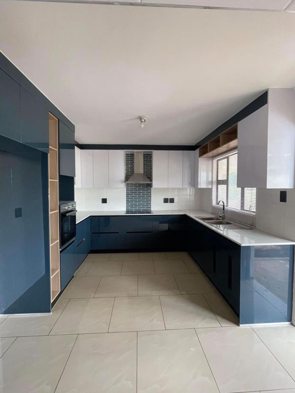Minimalist handle-free kitchen with push-open cupboards installed in Boksburg, East Rand by Elite Wood Works