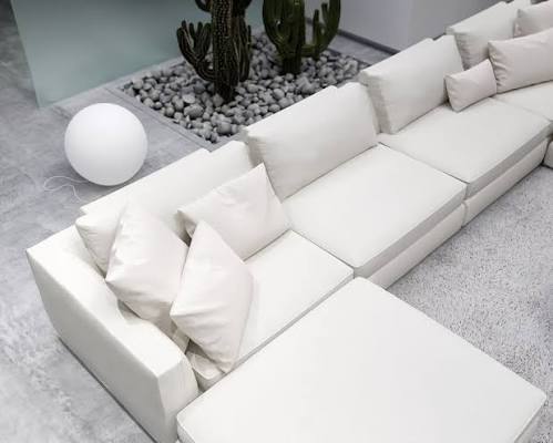 Overhead view of custom white modular sectional couch arrangement