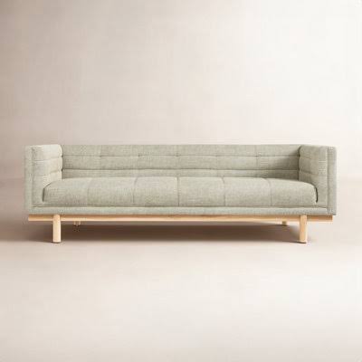Scandinavian minimalist green sofa with exposed solid oak wooden frame