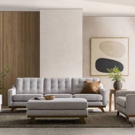 Light grey tailored sofa and matching upholstered ottoman with wooden legs