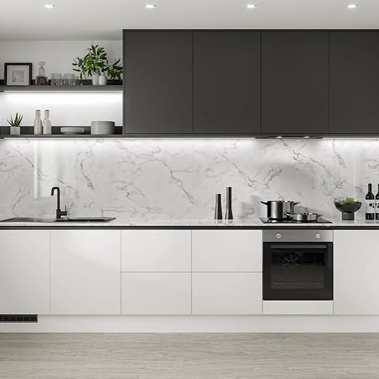 High-gloss two-tone kitchen cabinetry with designer island unit