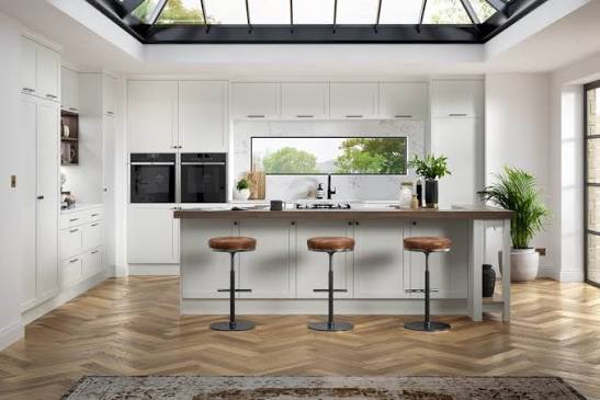 Custom Shaker style kitchen cabinetry with framed panel doors
